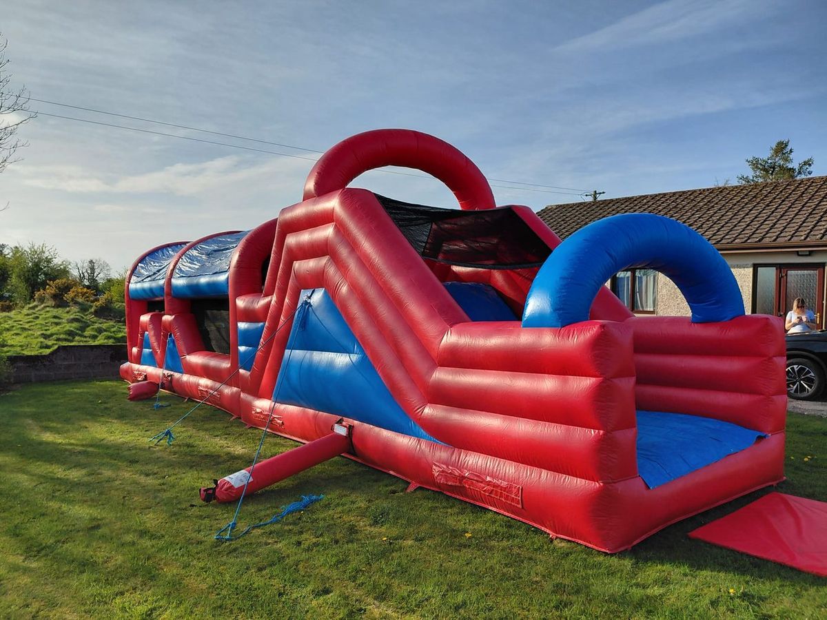 Red and blue obstacle course on grass